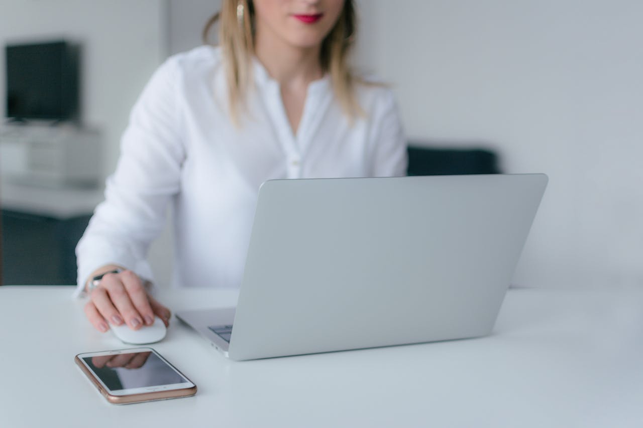 A worker researching FEHA discrimination on a laptop