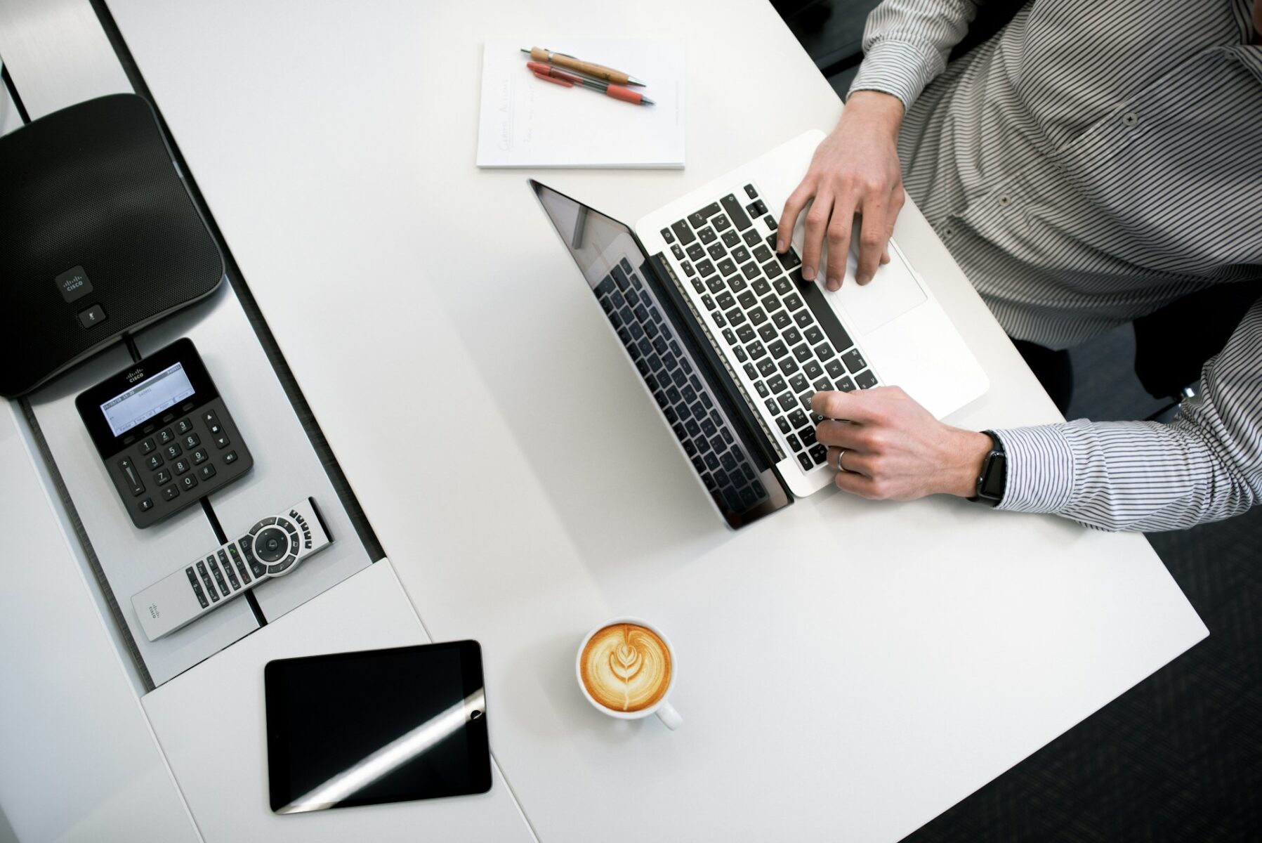 Business professional documenting unreimbursed business expenses on a laptop.